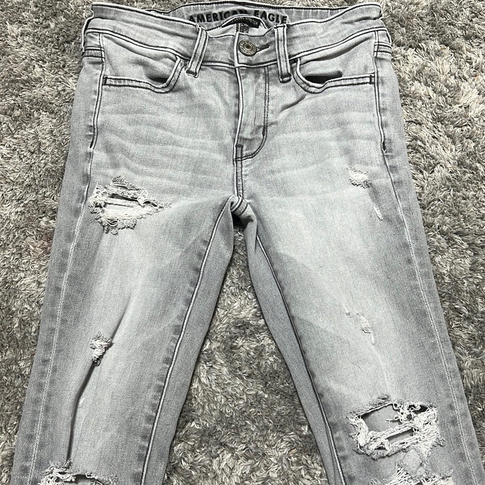 Grey American Eagle ripped jeans.